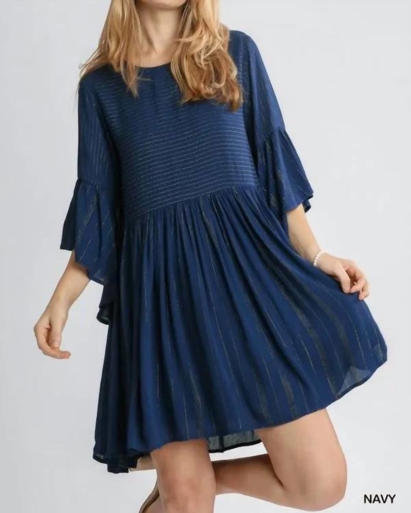 Front of a model wearing a size L Babydoll Dress In Navy in Navy by Umgee. | dia_product_style_image_id:344815